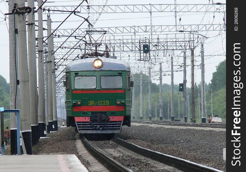 The electric train arrives on railway station