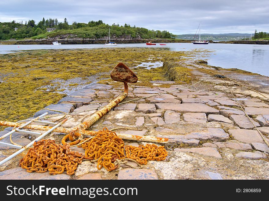 Rusty anchor on jetty at Badachro, Nw Scotland