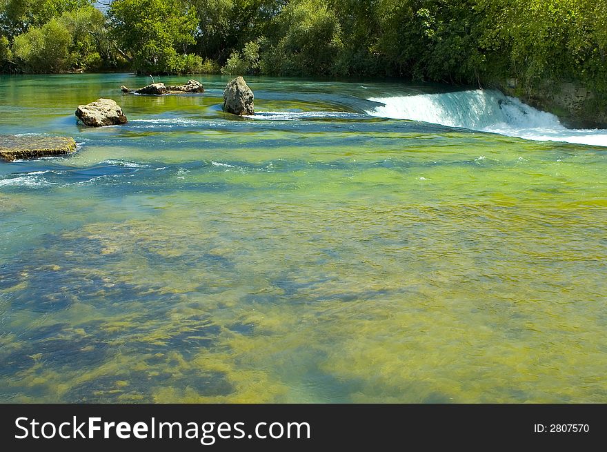 Green river and waterfall