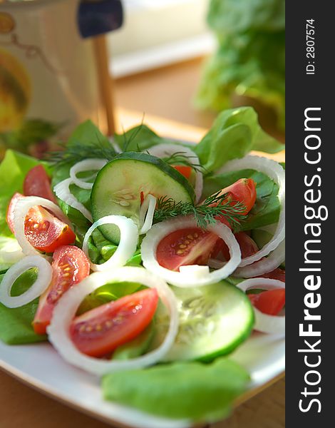 Delicious vegetable salad with tomato, onion and cucumber. Delicious vegetable salad with tomato, onion and cucumber