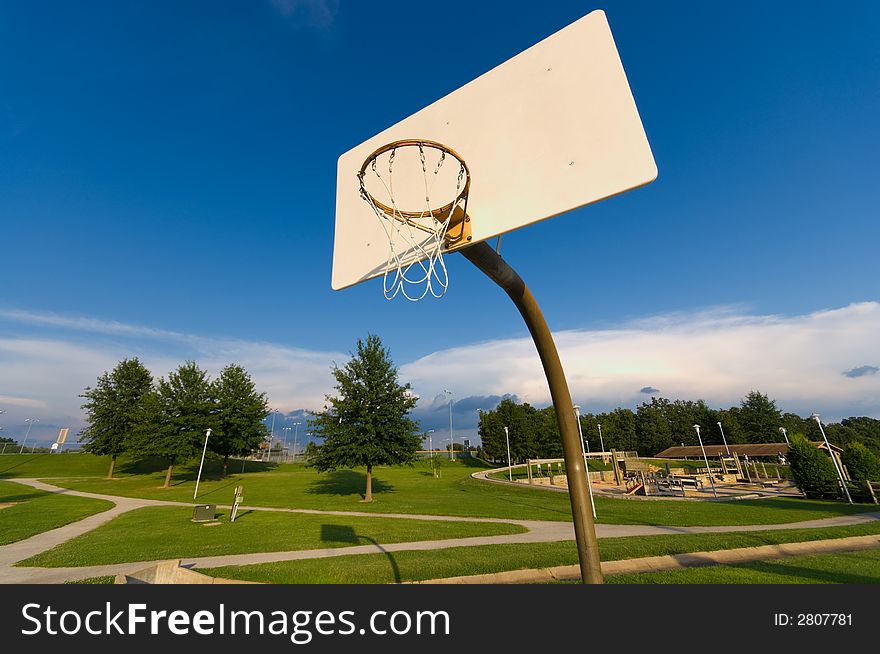 Basketball hoop and net with blue sky background. Basketball hoop and net with blue sky background