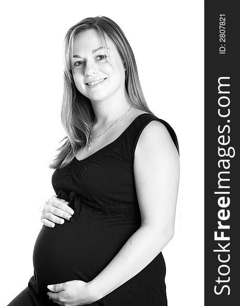 Black and white, portrait of a beautiful pregnant woman.
