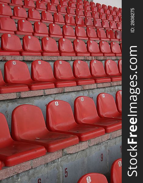 Stadium seats, in europe ,red chair, A field of empty stadium seats.