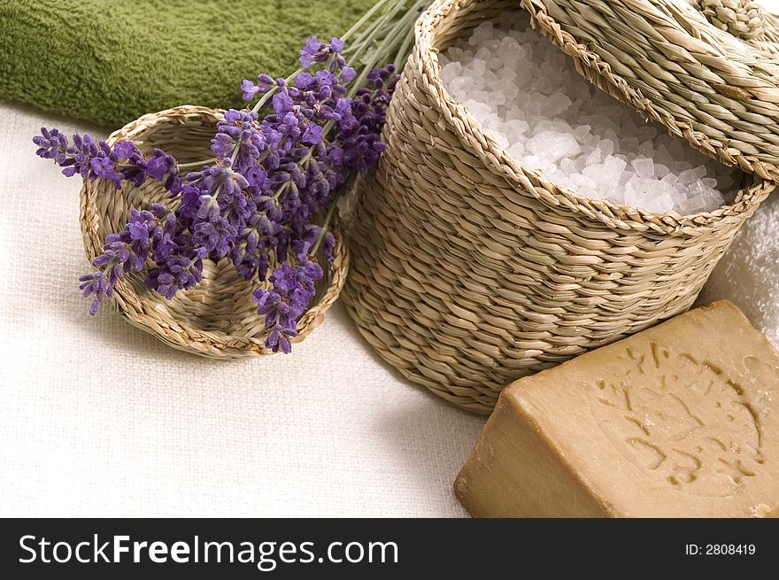 Lavender bath items. salt, towel, soap and fresh flower