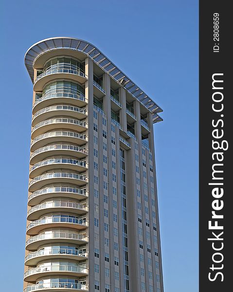 Modern condo tower with curved front. Modern condo tower with curved front