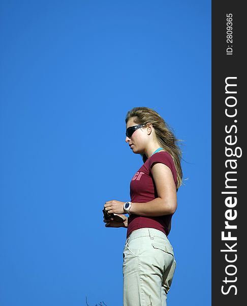 Young woman and a blue sky. Young woman and a blue sky