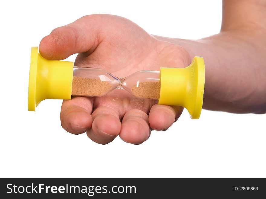 Sand-glass in a hand on white background