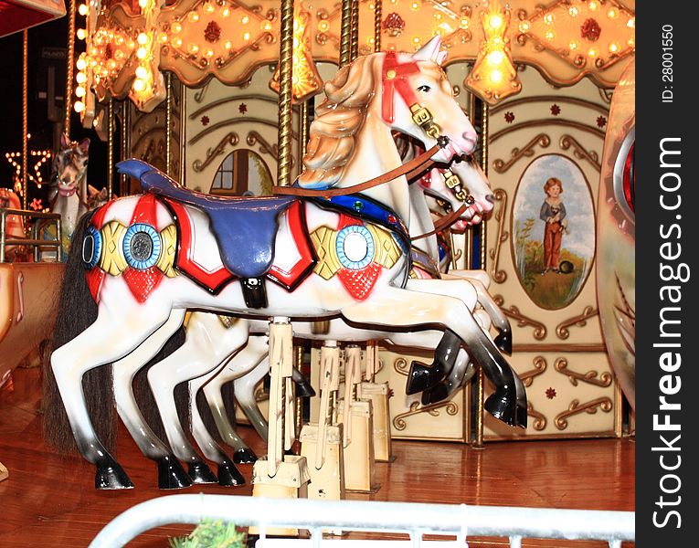 Row of three carousel horses
