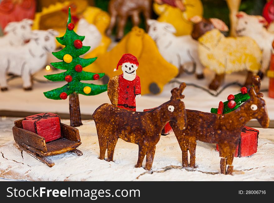 A funny Cristmas scene with figurines made by ginger bread. A funny Cristmas scene with figurines made by ginger bread.