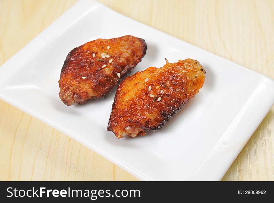 Grilled chicken wings in the dish inside