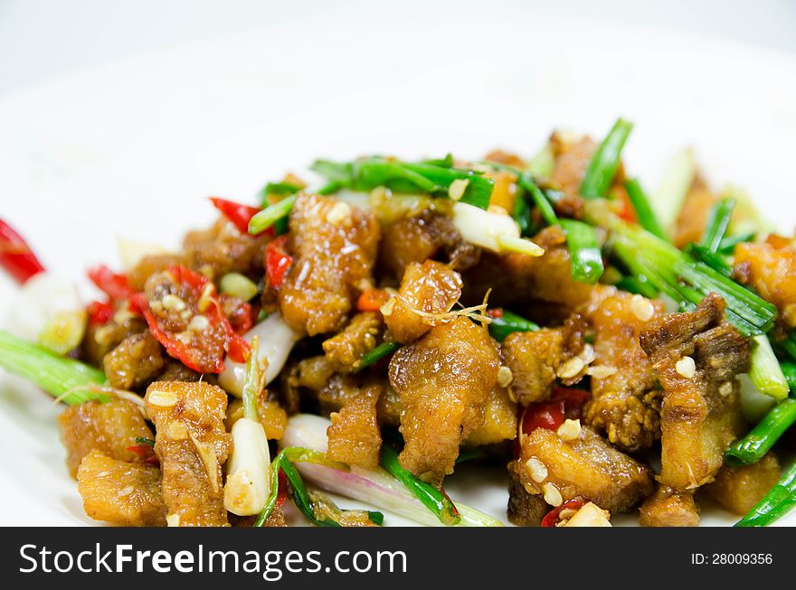 Thai food spicy fried pork with chili