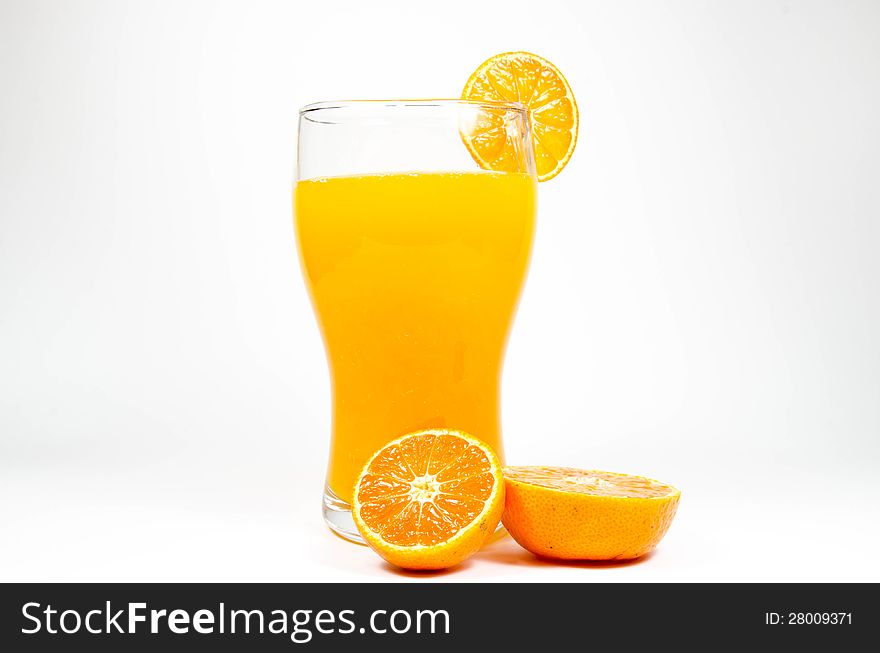 Orange juice and slice on white background