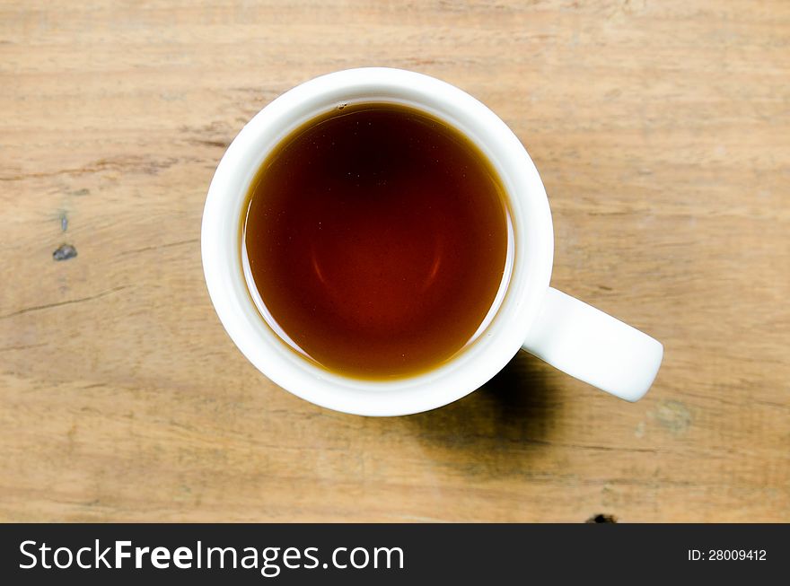 A cup of tea on wood background