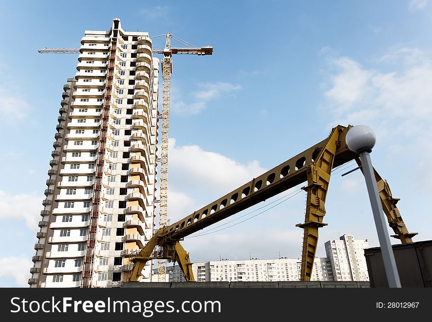 Building a new home in the city center during the day. Building a new home in the city center during the day