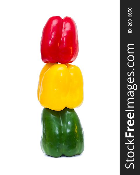 Three colored peppers  on white background