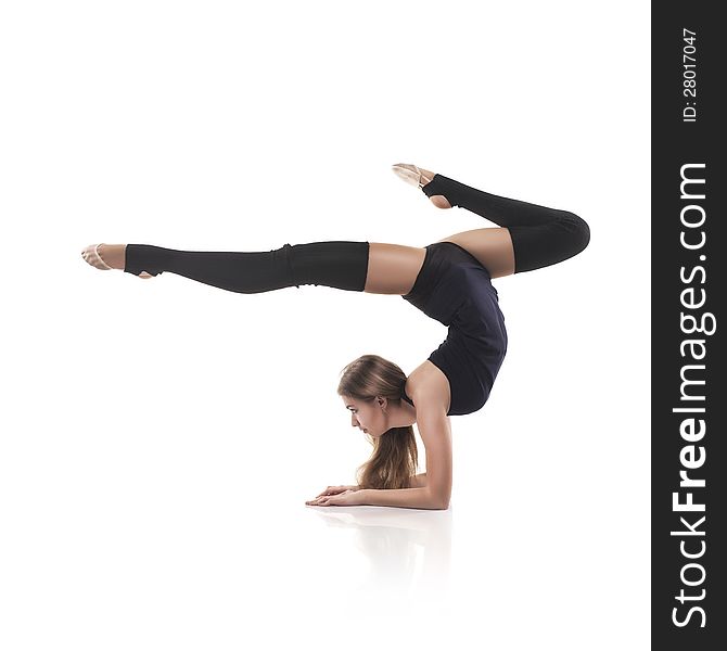 Studio shoot of cute woman gymnast on white background