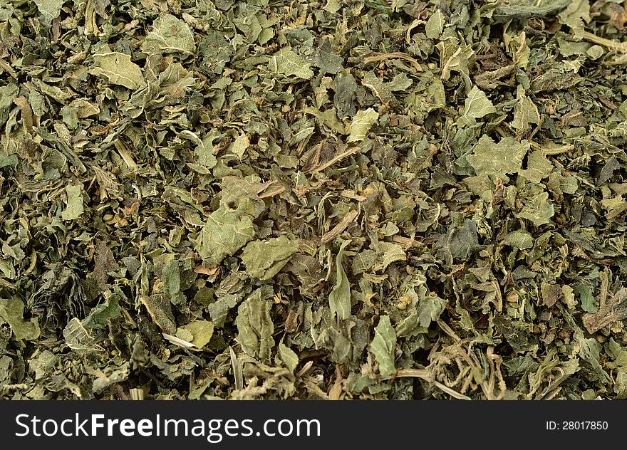 Close up of dried nettle tea on white background