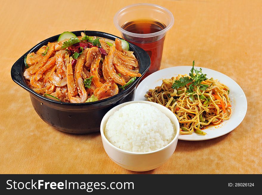 Chinese cuisine - tripe casserole and rice, with vegetables, salad and soda