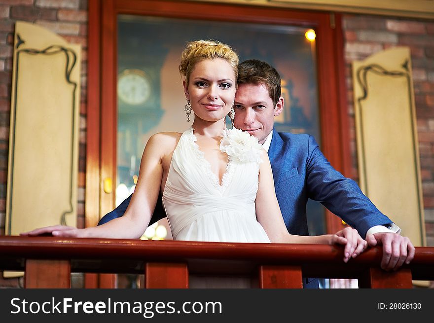 Happy Bride And Groom In Interior