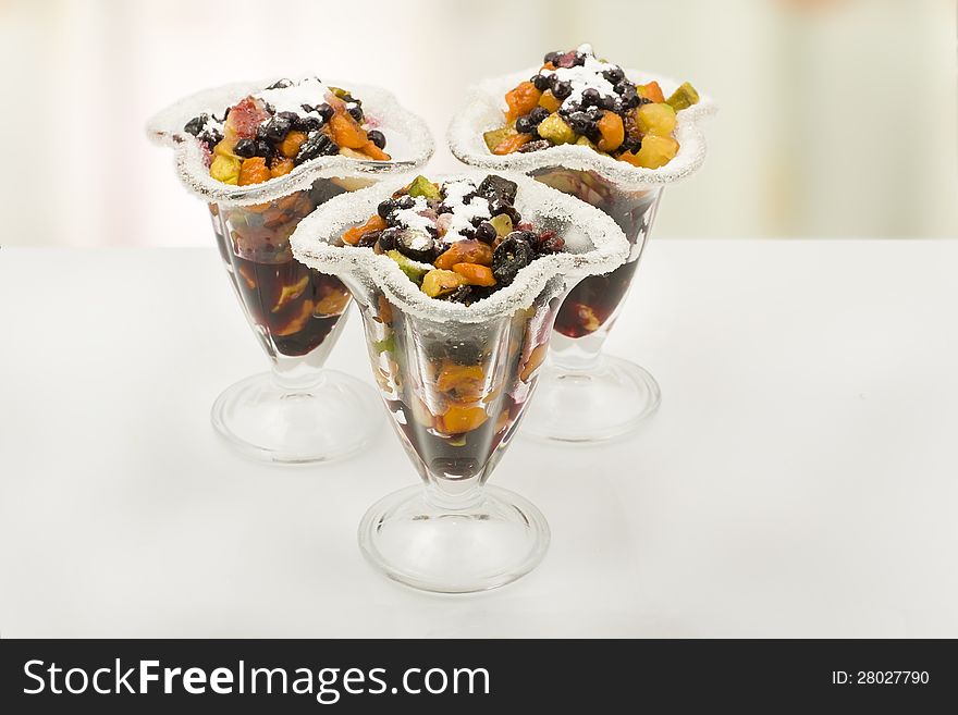 Pumpkin dessert with fruit in a glass sundae dish