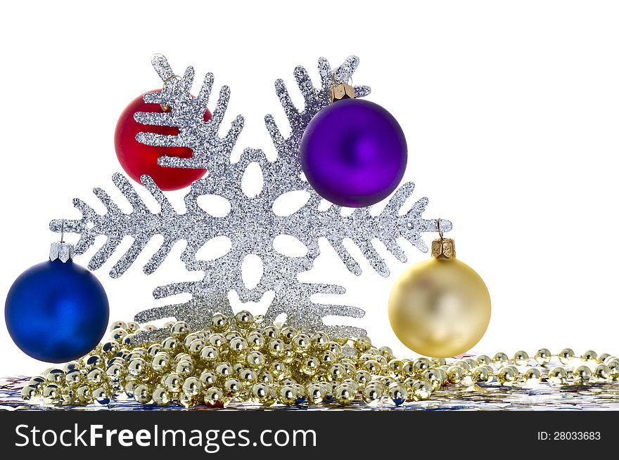 Decorative snowflake with Christmas balls isolated on white.