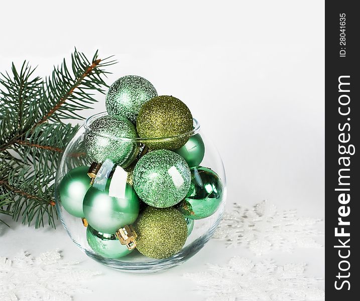 Christmas balls in round glass vase with copy-space. Christmas balls in round glass vase with copy-space