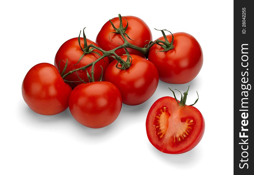 Six red tomato and green branch on a white background. Six red tomato and green branch on a white background