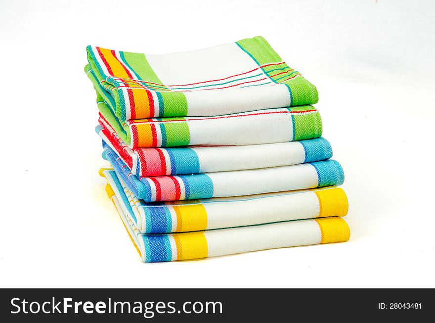 Stack of colorfull dishtowels isolated on white. Stack of colorfull dishtowels isolated on white