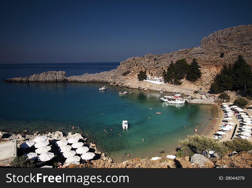 Torquois hidden bay in Rhodes Greece