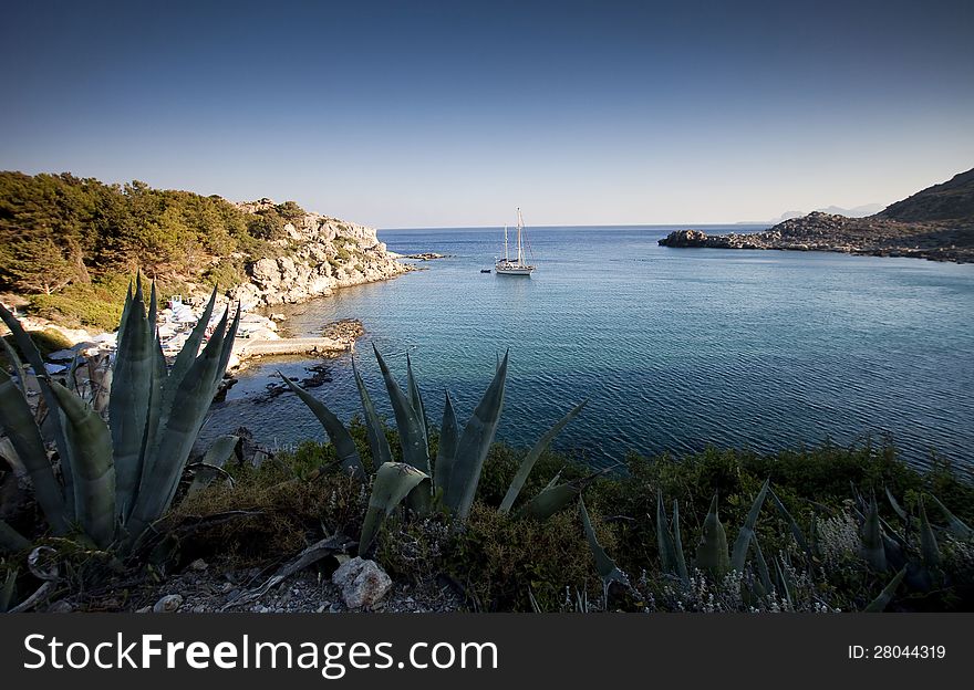 Torquois hidden bay in Rhodes Greece