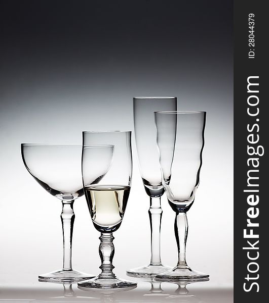 Different champagne glasses on dark background