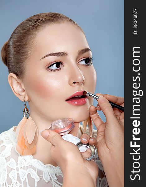 Woman with Brush for Professional Make-up