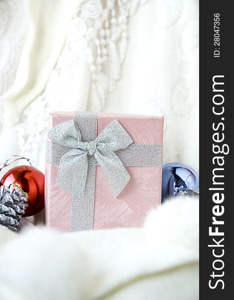 Close up pink gift box with ornament