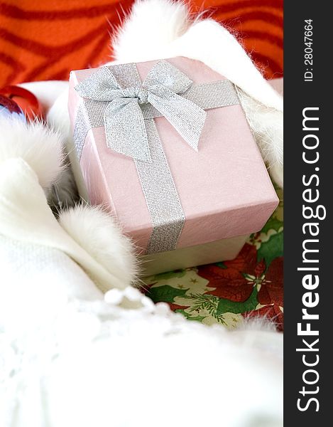 Pink gift box on Christmas background