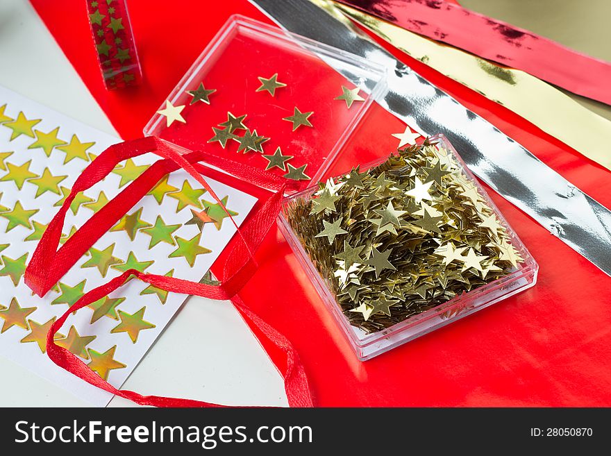 Christmas decoration with stars: paper, table stars, stickers, masking tape, bands. Christmas decoration with stars: paper, table stars, stickers, masking tape, bands.