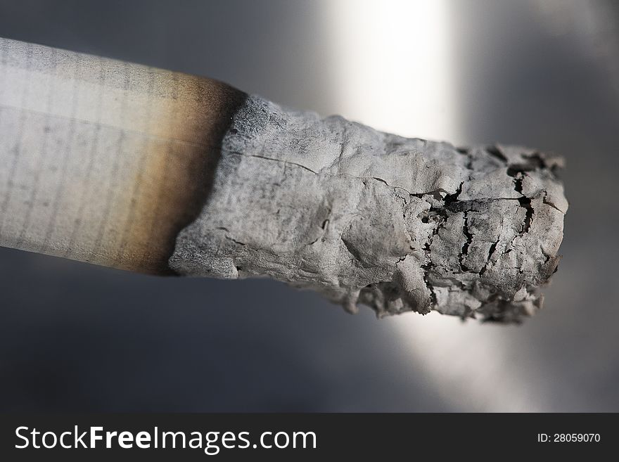 Image shows a burning cigarette