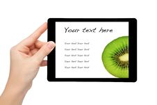 Woman Hand Hold A Mini Tablet With Kiwi Stock Photos Woman Hand Hold A Mini Tablet With Kiwi Stock Photos