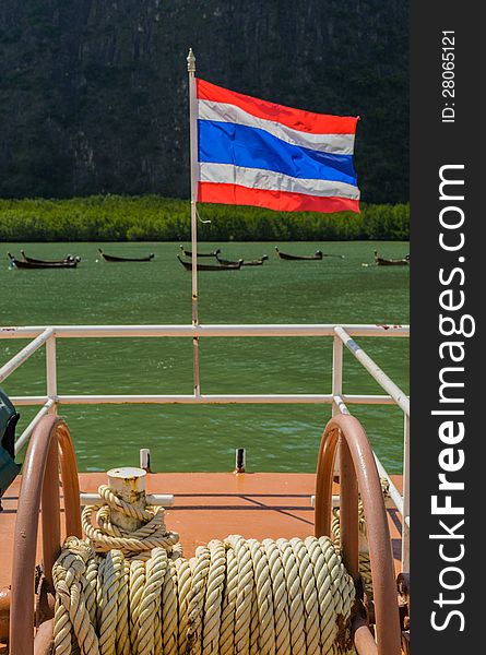 Thai nation flag is on a escort boat