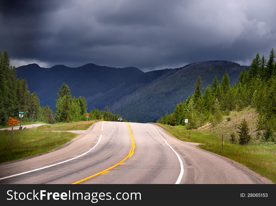 Scenic road in Glacier national park on a stormy day