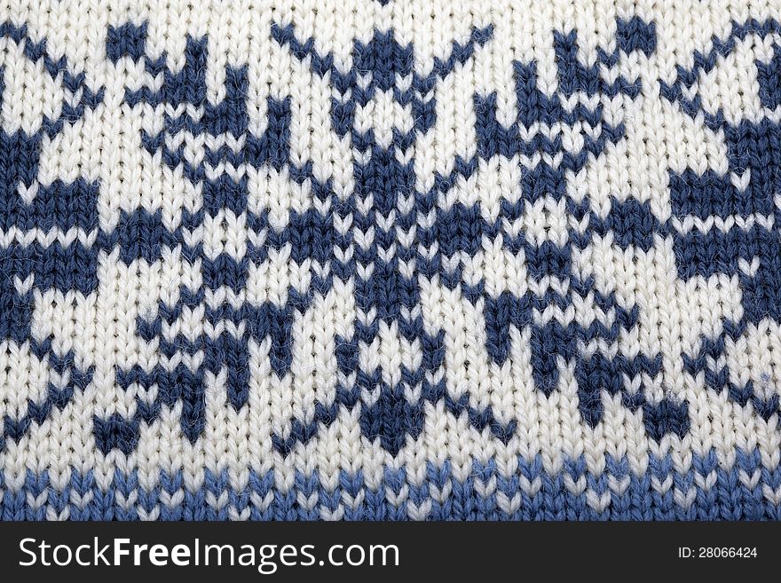 Knitted material with Nordic pattern for use as background. Knitted material with Nordic pattern for use as background