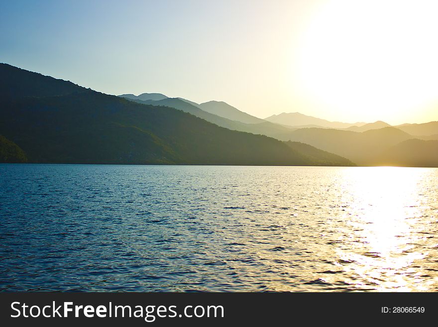 Very beautiful landscape of the sea, mountain and the sun