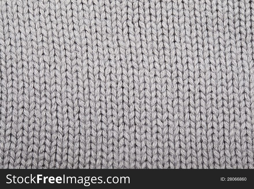 Gray knitted material for use as a background. Gray knitted material for use as a background