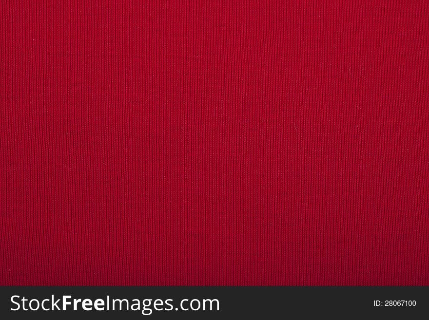 Red knitted material for use as a background. Red knitted material for use as a background