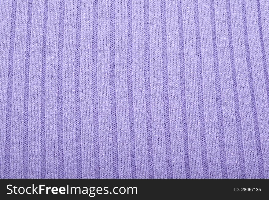 Purple knitted material for use as a background. Purple knitted material for use as a background
