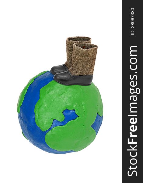 Plasticine Globe earth with felt boots on a white background. Plasticine Globe earth with felt boots on a white background