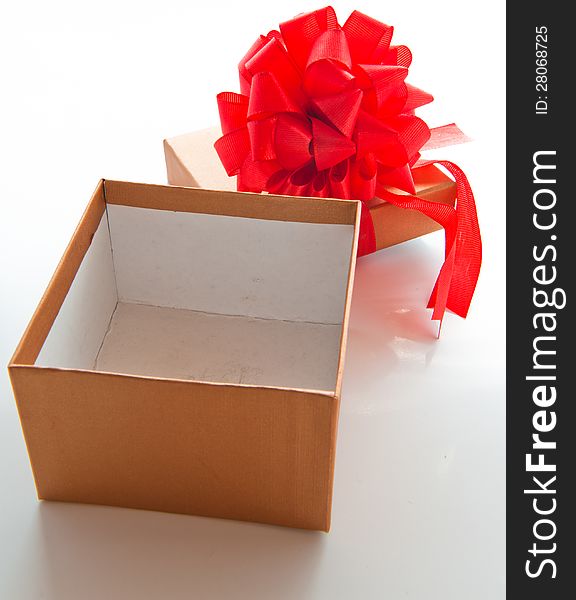 Gift box with red bow for Christmas or Valentine's day