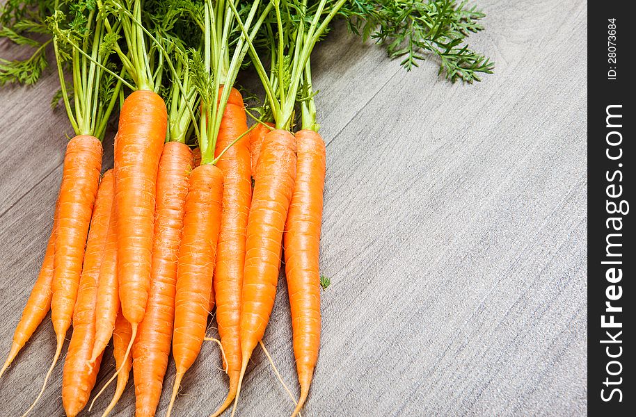 Carrots bunch lying on floor
