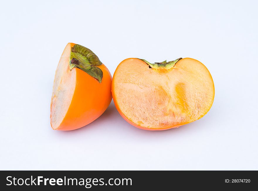 Persimmon fruit cut one side front in white background