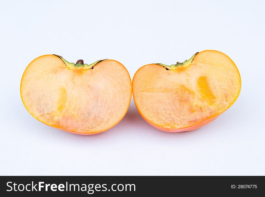Persimmon fruit cut two side section in white background