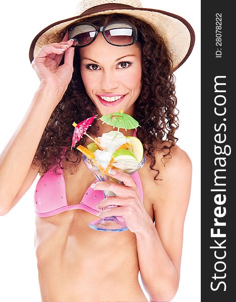 Pretty woman in bikini holding cup of fruits, isolated on white background